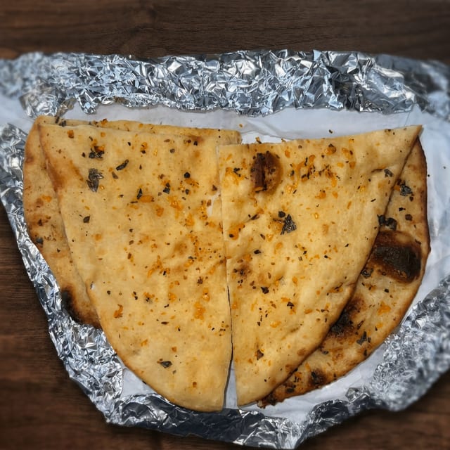 71. Garlic Naan.
