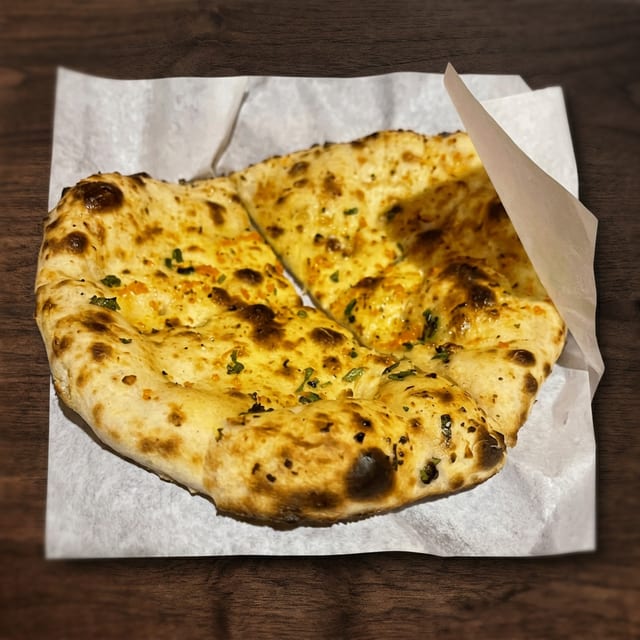 80. Chicken Garlic Naan.